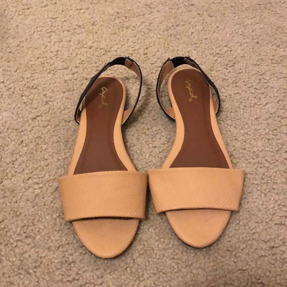 Tan and black flats